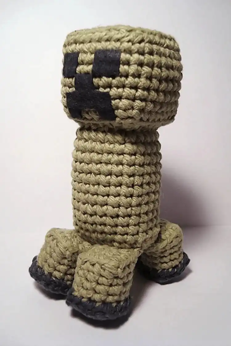 Crocheted green Minecraft Creeper amigurumi plushie