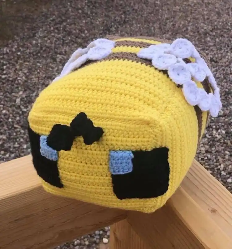 Large crocheted yellow and black Minecraft bee plushie with tiny wings