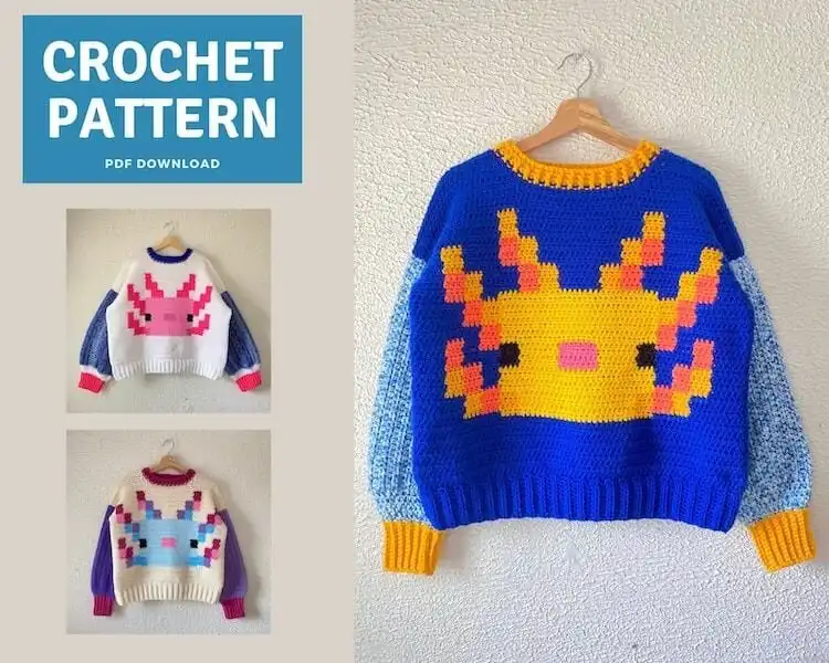Person wearing a crocheted sweater featuring a large pink Axolotl design