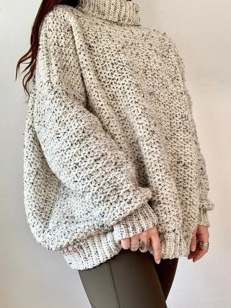 Creative Crochet Sweater Patterns - Vintage Brands Design and Birds Design 18 Elegant Vienna Sweater, an oversized turtleneck design that resembles a high-end department store garment.