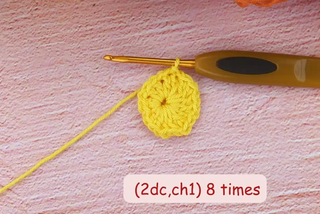 A close-up photo tutorial shot showing the initial foundation chain and slip stitch of the African flower square, demonstrating the first step in the Crochet African Flower Granny Square Tutorial.