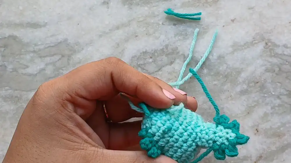 Crocheted tail piece for the Crochet Baby Axolotl With Custom Gills and Bubble-Stitch Limbs, ready for attachment.