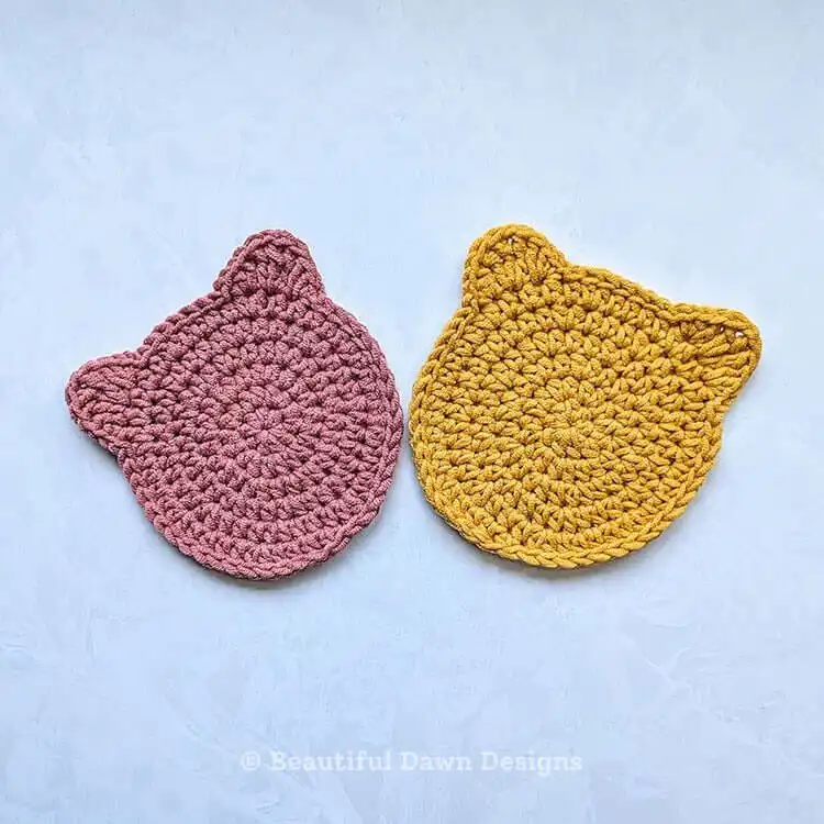 Detailed shot of a single Crochet Cat Coaster Free Easy Pattern, emphasizing the texture of the stitches and the defined ear shape.