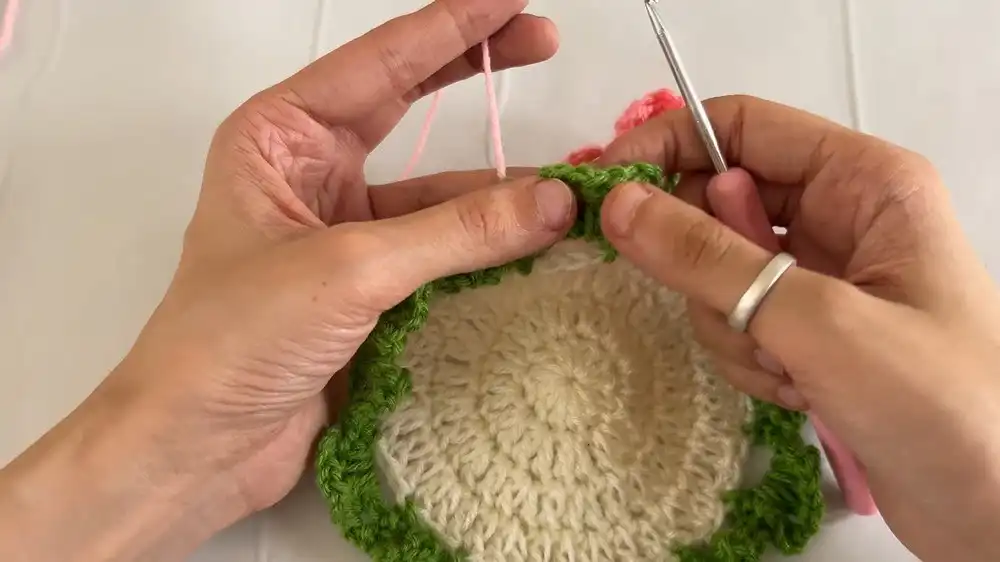 Step-by-step visual of the initial rounds for crocheting the base of the Puff Flower Coaster with increasing double crochet stitches.