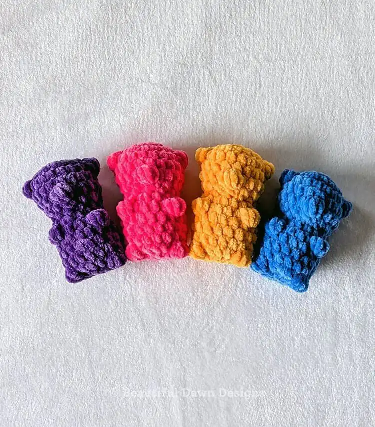 Bright yellow no-sew gummy bear crochet plushie, squishy and beginner-friendly.