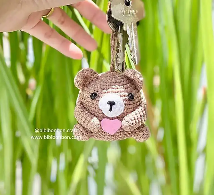 Small brown crochet bear keychain attached to a metal ring.