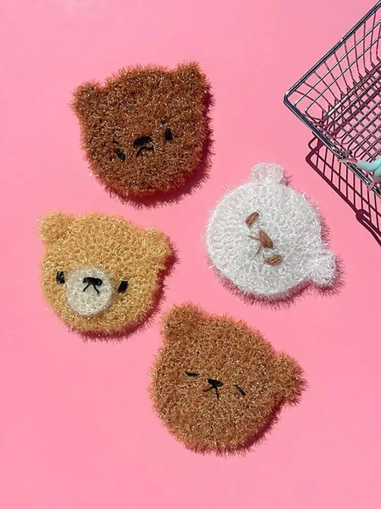 Round, textured brown crochet bear dish scrubby with small ears.