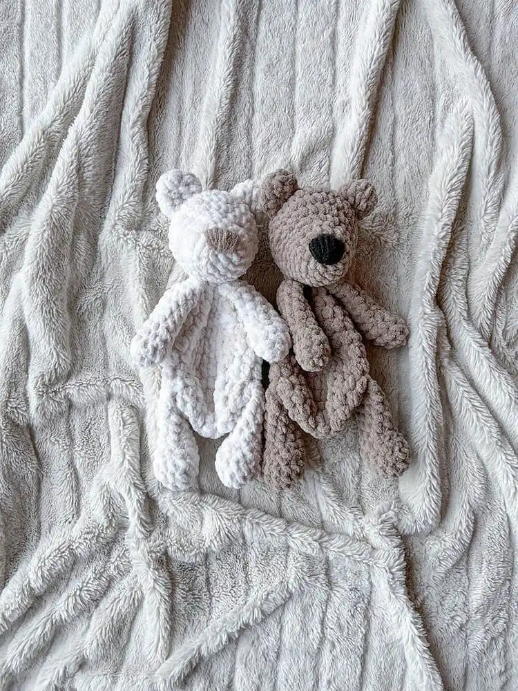 Flat crochet bear snuggler, Jr. Bear, in a soft brown yarn, perfect for babies.