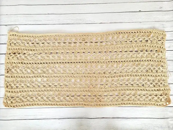 A finished rectangular crocheted panel, ready to be joined as part of the Crochet Lacy Summer Poncho construction.