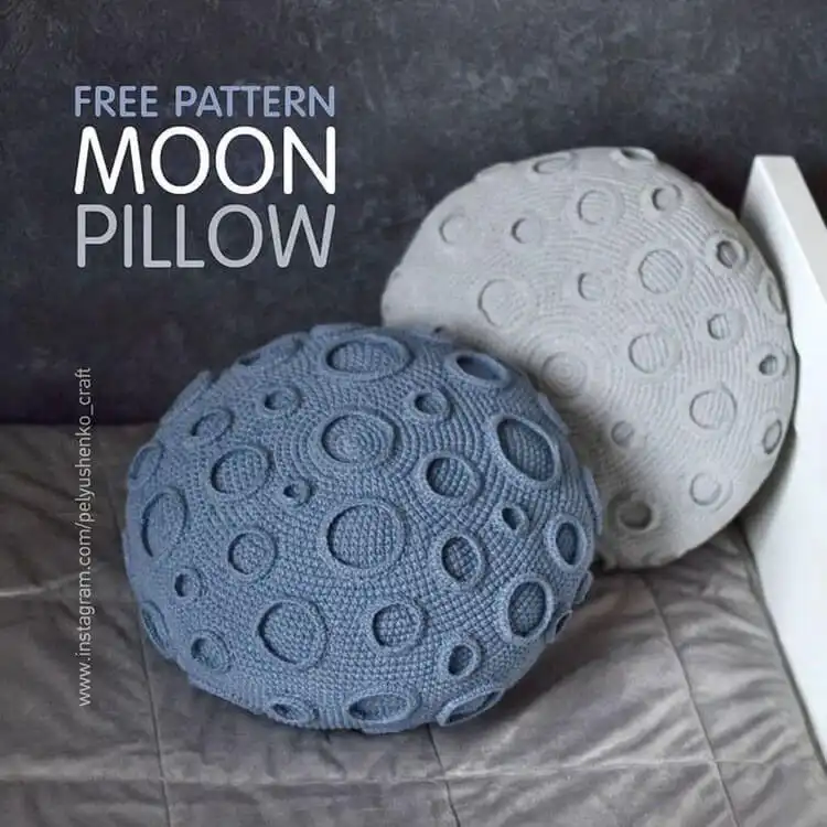 Textured round crochet moon pillow depicting lunar craters in shades of gray