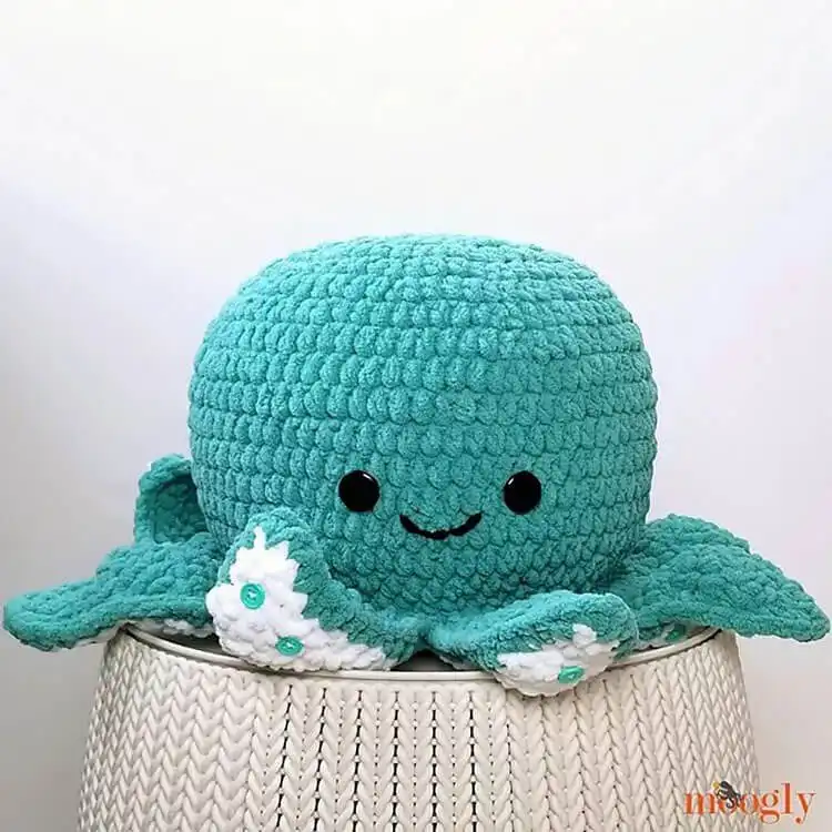 Giant, soft crochet octopus plushie in a vibrant purple yarn, with long squishy tentacles