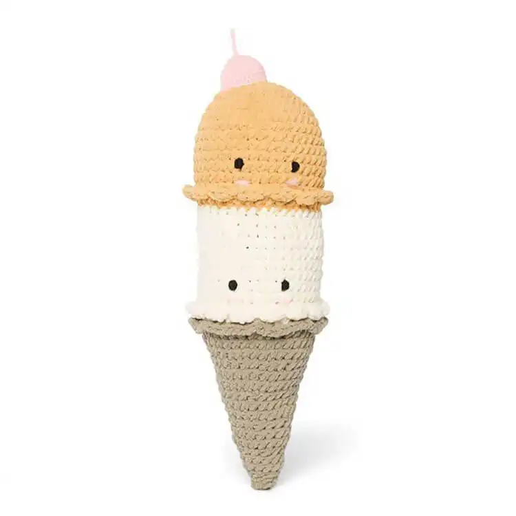 Oversized crochet ice cream cone pillow with a pink scoop and waffle cone texture