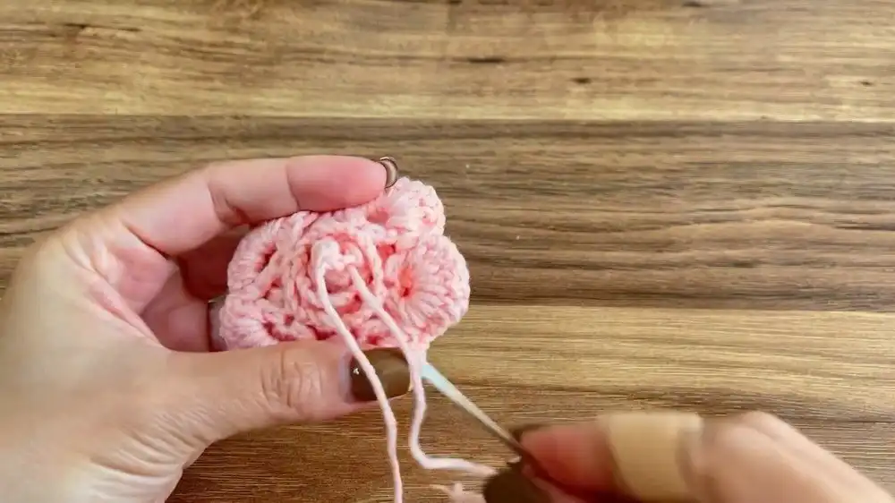 Step-by-step image of rolling and forming the Crochet Rose Pattern - DIY Crafts into its final shape