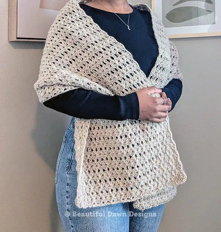 A gentle Hallelujah Prayer Shawl in a soothing cream color, with delicate texture and fringe.