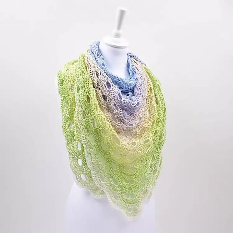 A popular Virus Shawl in a light green fingering weight yarn, showing its characteristic fan-like stitch pattern.