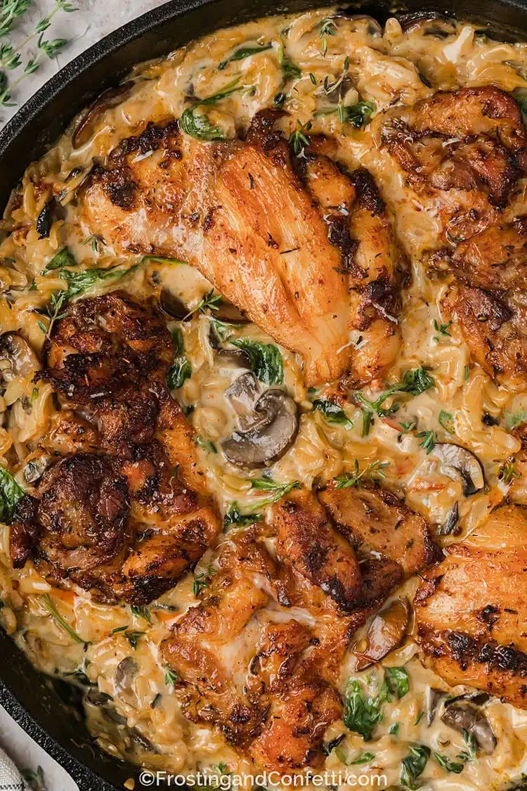 Creamy Chicken Orzo Bake in a casserole dish, rich with chicken, orzo, sun-dried tomatoes, and spinach for a delicious Crockpot Chicken Nachos Recipe - Perfect Dinner Idea inspiration.