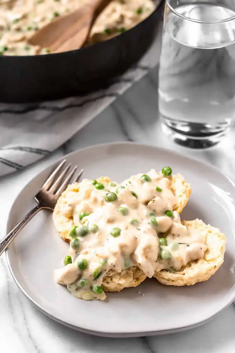 Creamed Chicken Over Biscuits, a classic comfort food with rich chicken gravy and warm biscuits, a nostalgic Crockpot Chicken Nachos Recipe - Perfect Dinner Idea.