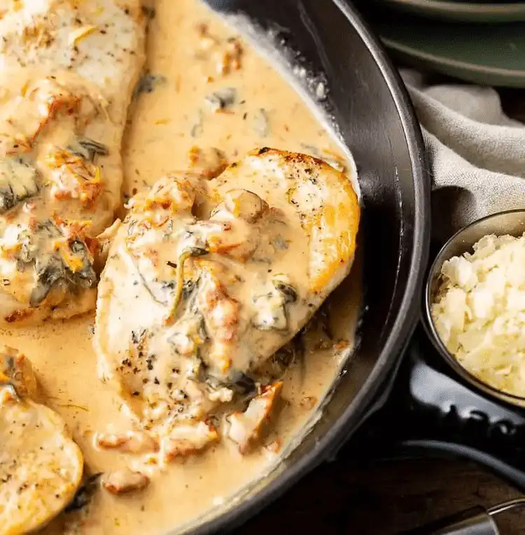 Creamy Tuscan Chicken, seasoned and covered in a rich Tuscan sauce with spinach and sun-dried tomatoes, a vibrant Crockpot Chicken Nachos Recipe - Perfect Dinner Idea.