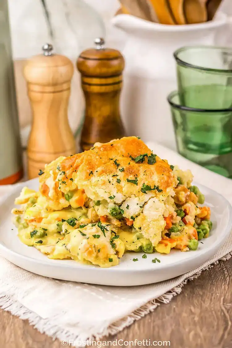 Golden-brown Chicken Cobbler with a flaky biscuit topping, featuring a savory chicken and vegetable filling, inspiring a Crockpot Chicken Nachos Recipe - Perfect Dinner Idea.