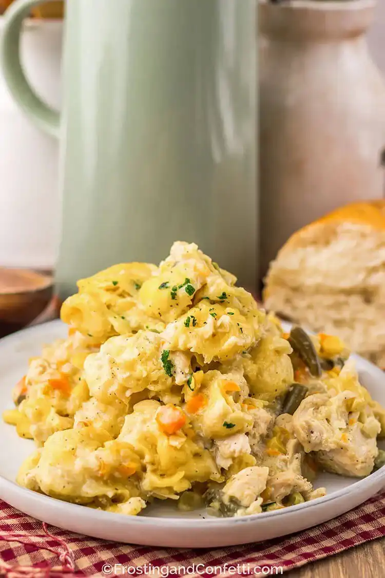 Slow Cooker Chicken and Dumplings Pot Pie, a hearty meal with tender chicken, vegetables, and fluffy biscuit dumplings, perfect for a Crockpot Chicken Nachos Recipe - Perfect Dinner Idea.