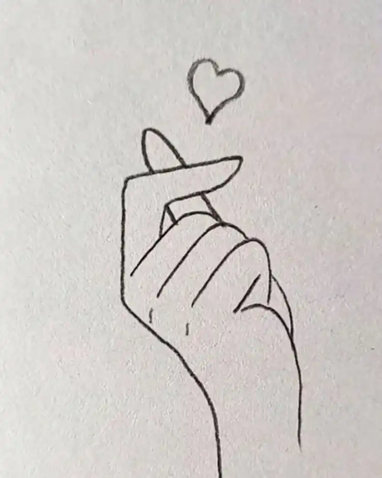 Cute Animal Drawing Idea - Cat/Kitten Holding a Strawberry 14 A simple and elegant sketch of a hand with a floating heart above it, perfect for conveying messages of love or affection quickly.