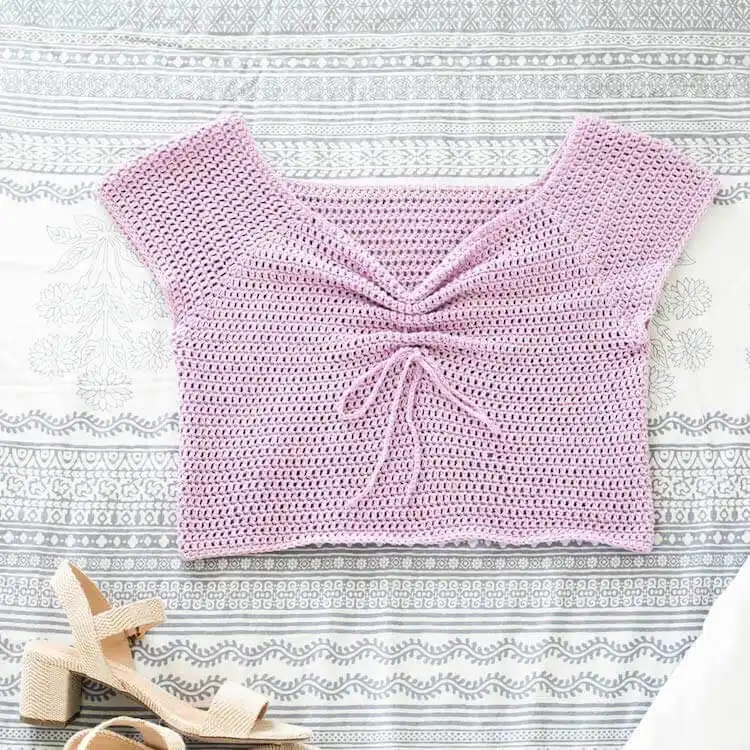 Stylish Ruffled Crochet Wrap Top, featuring elegant ruffle sleeves, perfect for summer fashion.
