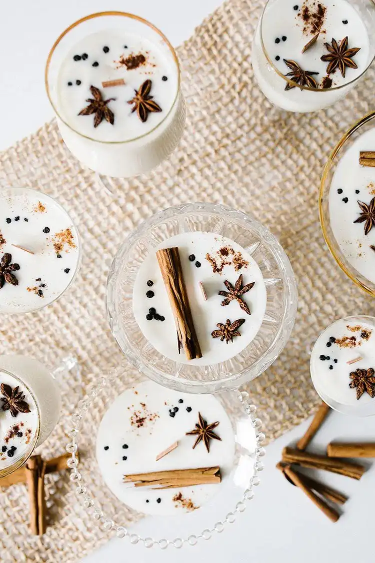 Close-up of an Eggnog Soy Wax Candle with a crackling wood wick, perfect for holiday gifting