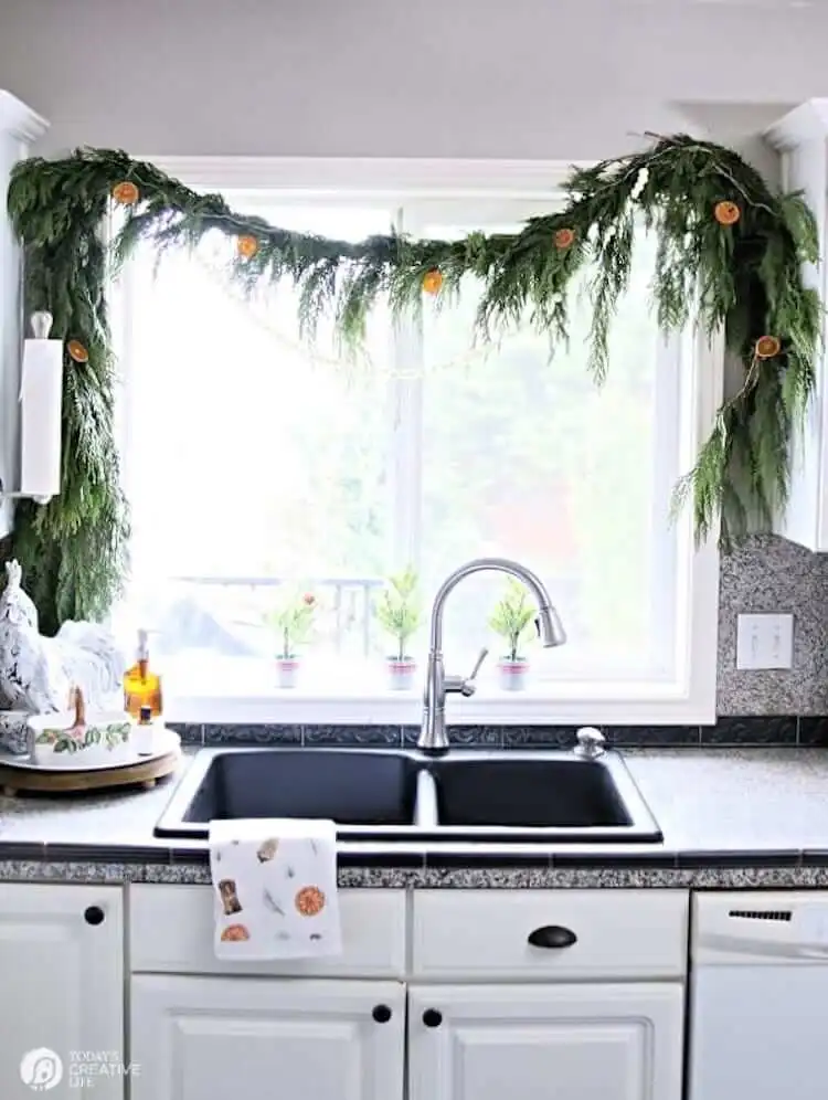 Elegant Vertical Dried Orange Garland hanging in a doorway, creating a beautiful cascading effect with translucent slices for holiday decor.