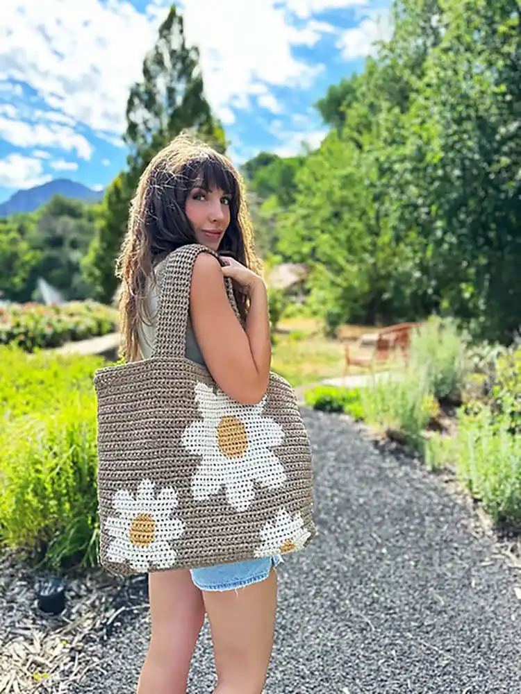 Easy Crochet Flower Bag Pattern 12 Sturdy Daisy Day Tote crochet bag with prominent colorwork daisies on both sides.