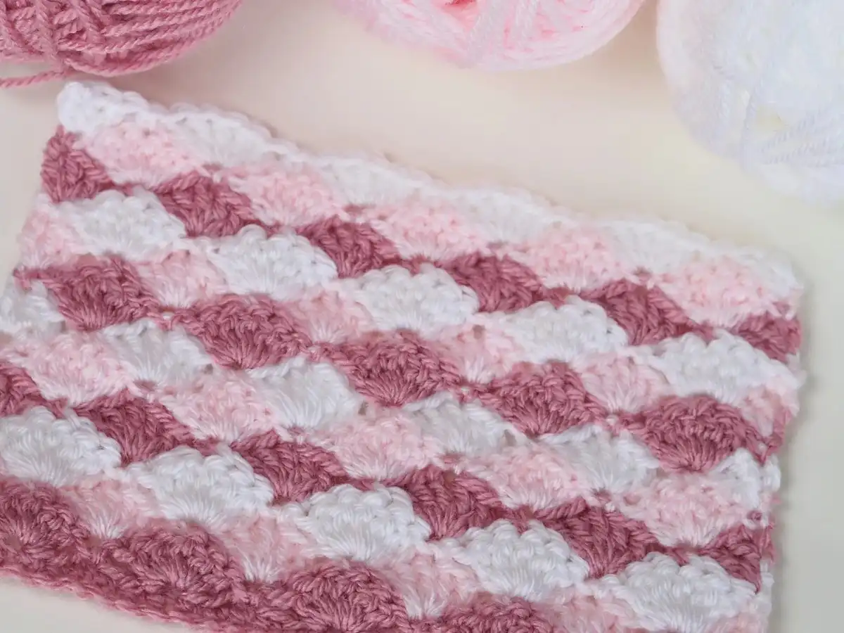 Close-up of a crocheted swatch demonstrating the wavy texture of the Easy Shell Stitch Crochet Pattern.