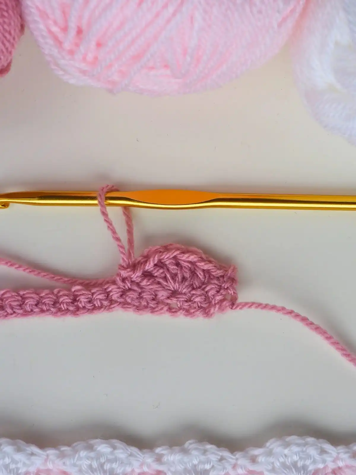 Photo tutorial showing the foundation row of single crochets for the Easy Shell Stitch Crochet Pattern.