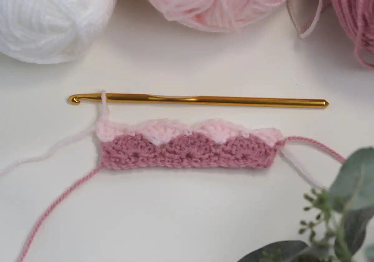 Photo showing the beginning of Row 2, illustrating how to create a half-shell for the Easy Shell Stitch Crochet Pattern.