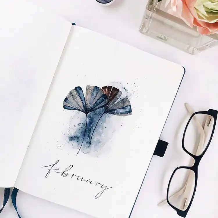Bright bullet journal cover page featuring whole and sliced lemons with green leaves for a fresh theme.