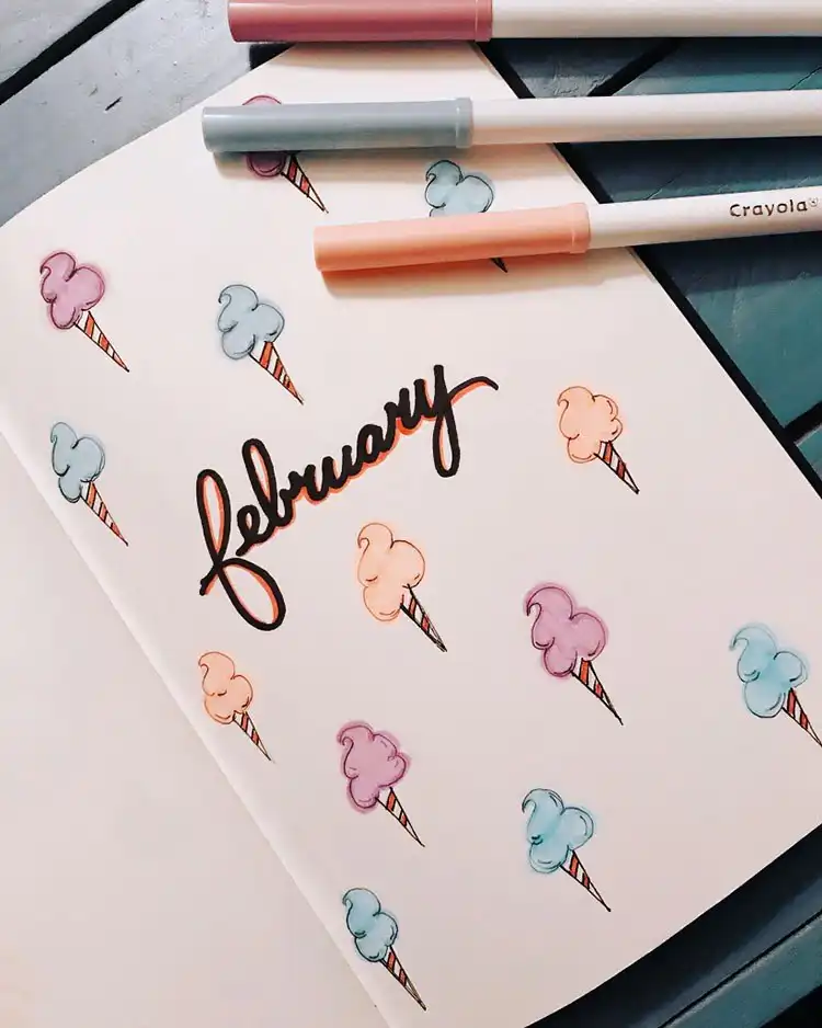 Calendar page with hearts hanging from strings and an adjacent page with colorful abstract shapes.
