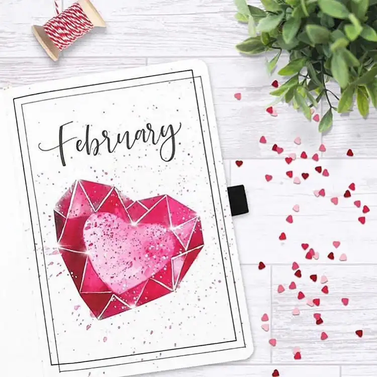 Minimalist bullet journal cover page with soft pink hearts and clean, elegant lettering for February.