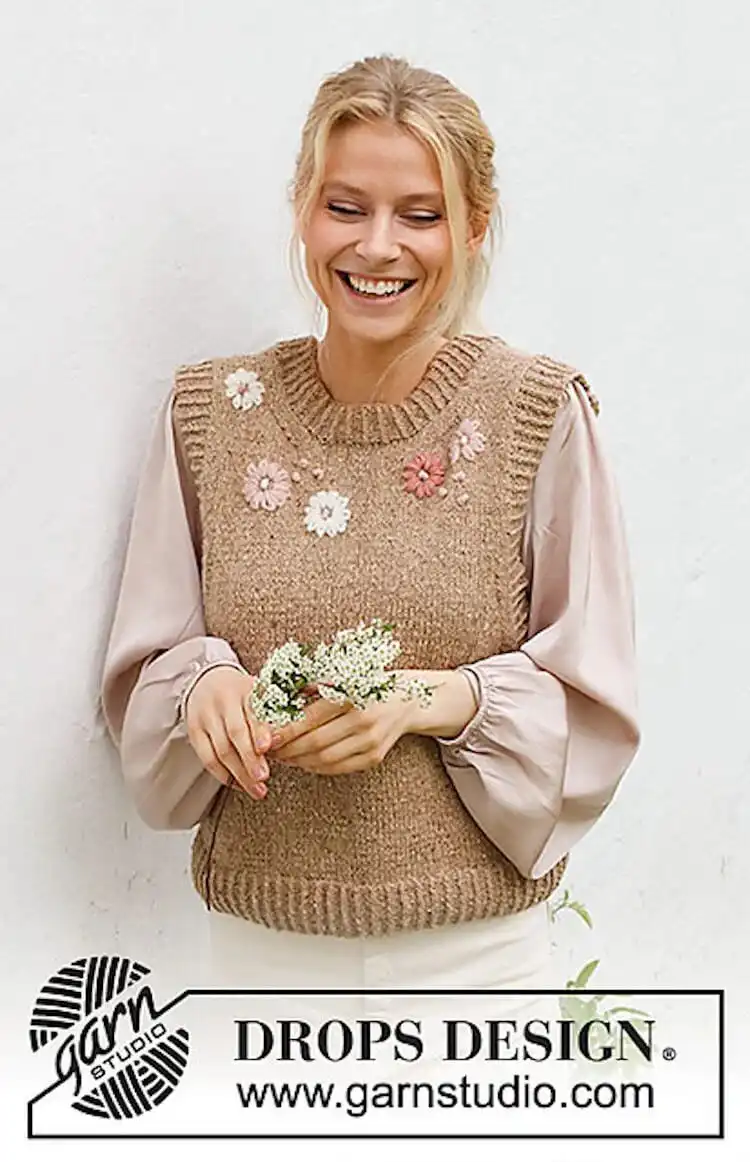 A springtime Flower Harmony Vest with embroidered floral details and delicate ribbed edges.