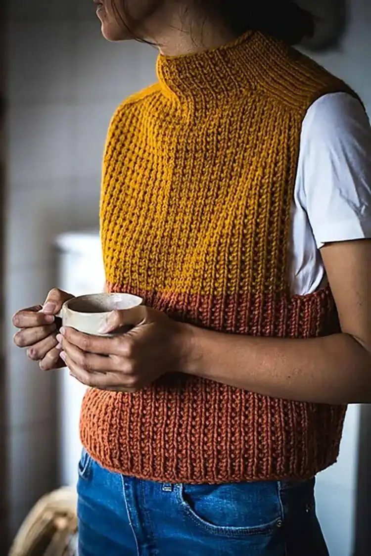 Close-up of a Timbo Vest, highlighting the unique broken rib stitch texture and seamless top-down construction.