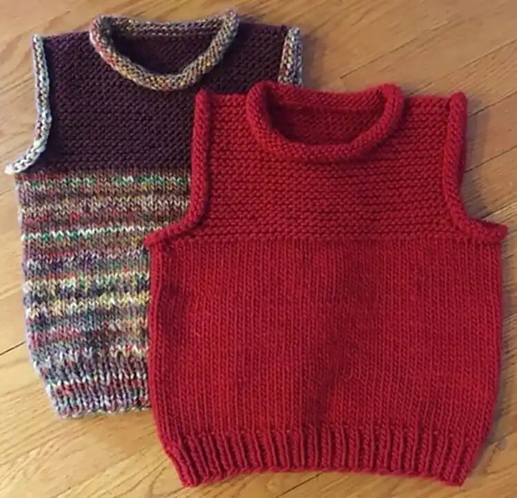 A cozy, chunky Heartwarming Vest in a warm color, displaying its garter stitch yoke and comfortable bulky yarn texture.