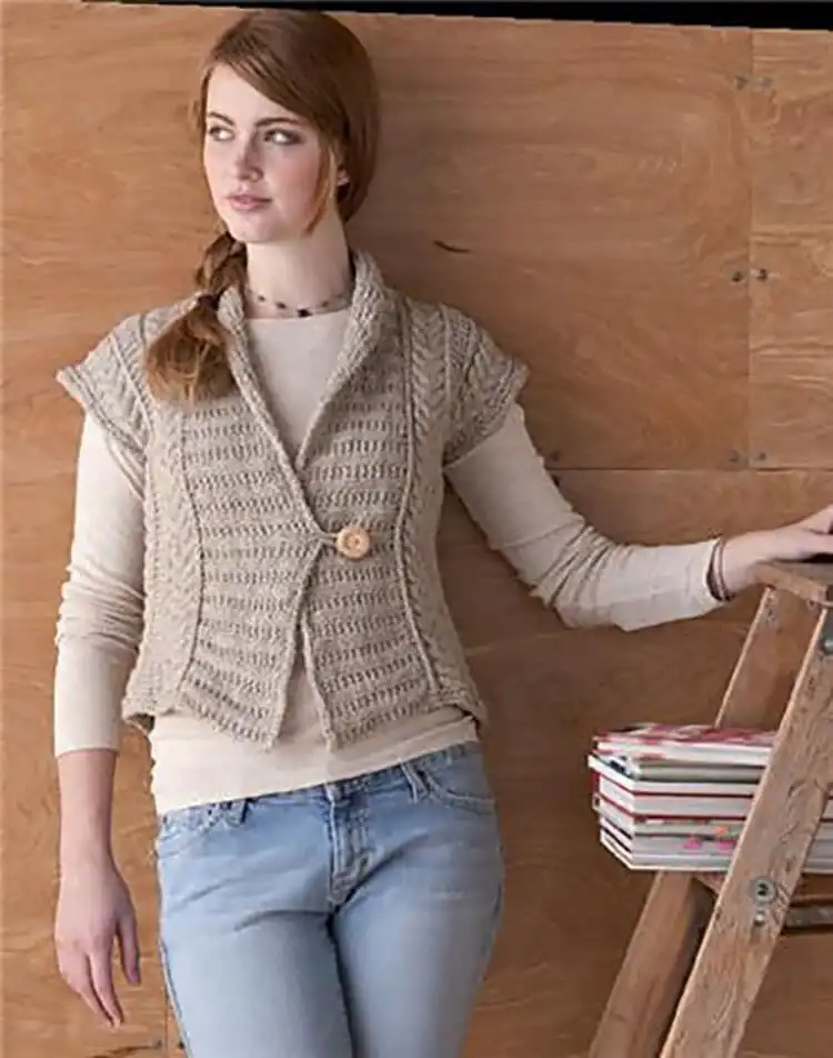 The Eco Vest, featuring intricate cable stitches used for shaping instead of traditional increases/decreases, in a natural fiber.