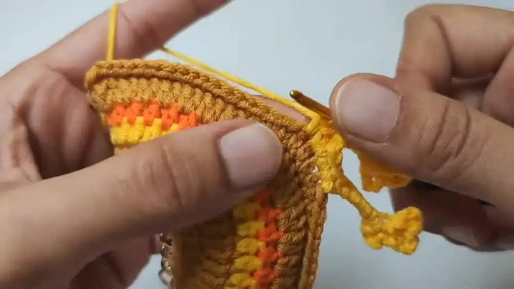 Visual guide for crocheting the yellow feet for the Free Crochet Rooster Keychain Pattern, including the three-toed design.