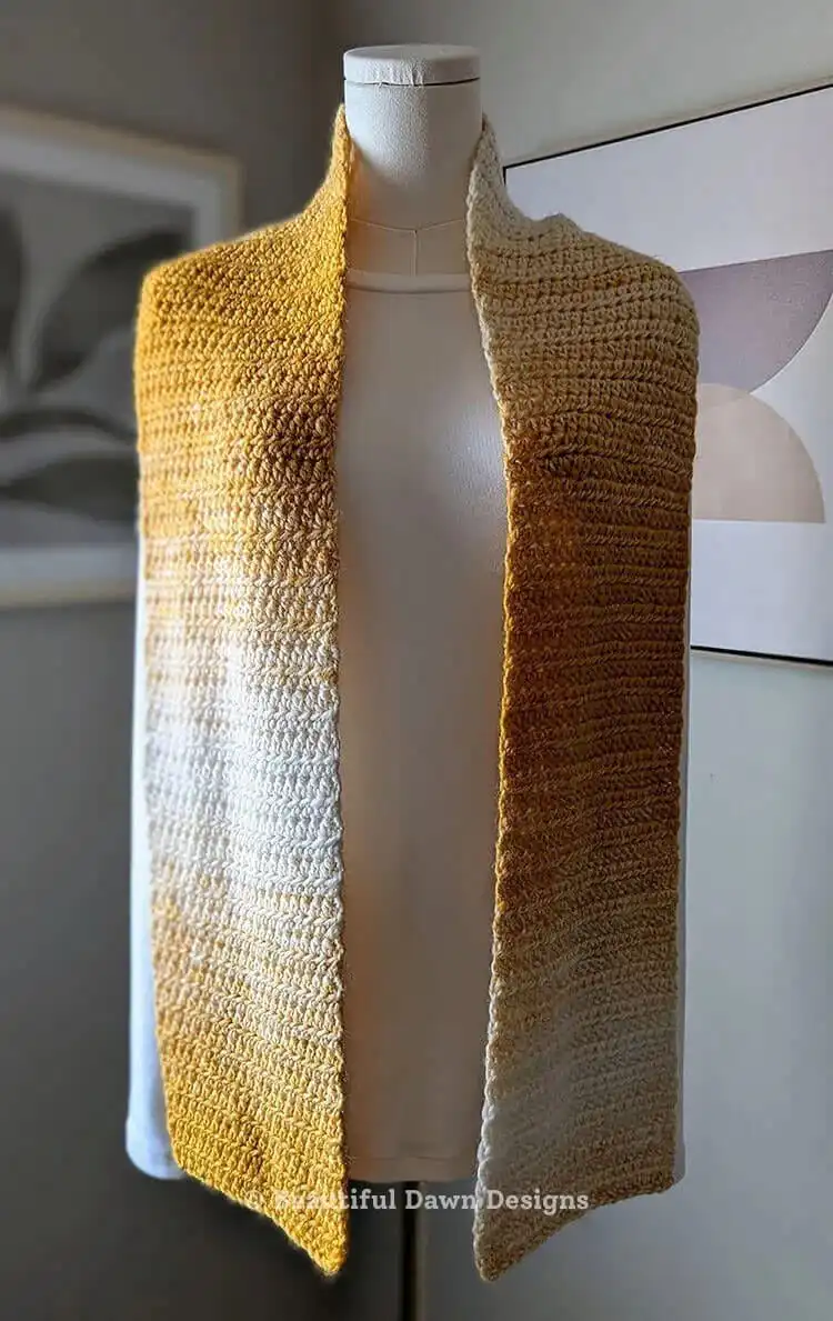 Materials laid out for the Free Crochet Scarf Pattern for Absolute Beginners, including bulky yarn, crochet hook, and notions.