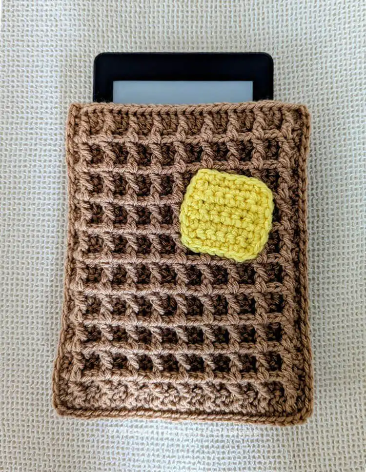 Top-down view of the Free Crochet Waffle Kindle Case Pattern, highlighting the texture and opening for the e-reader.