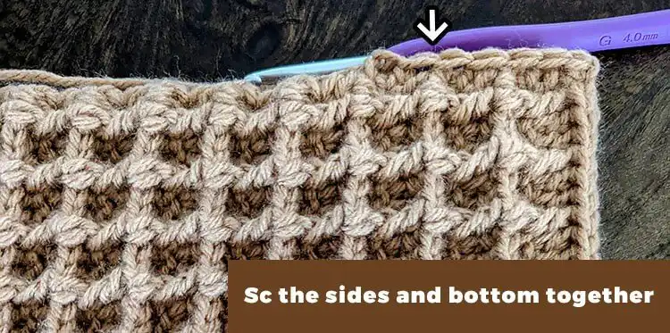 Crochet panels being sewn together to form the Free Crochet Waffle Kindle Case Pattern, showing the joining stitch.