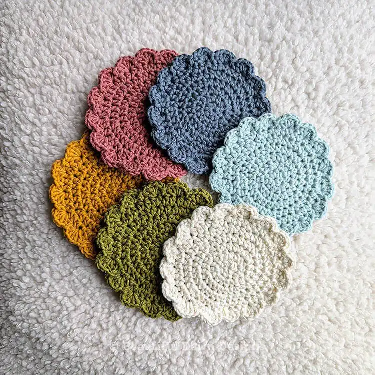 Variety of quick and easy crochet coasters in different colors, showcasing customization options for the Free Quick and Easy Crochet Coaster Pattern - Great Handmade Gift Idea
