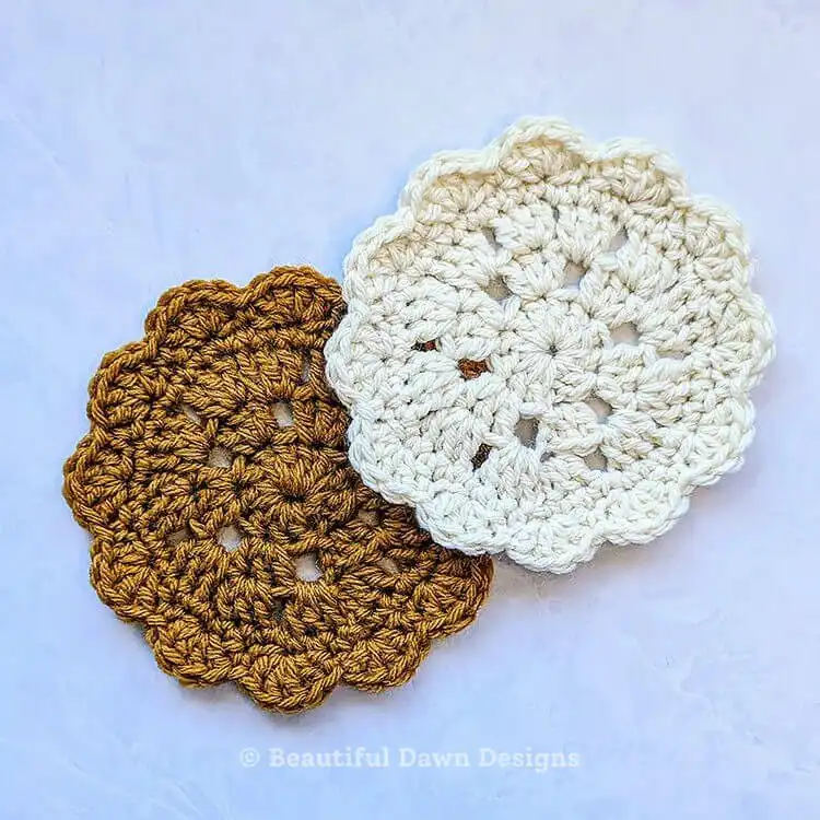 A purple Granny Cluster Coaster, showcasing the classic granny stitch pattern.