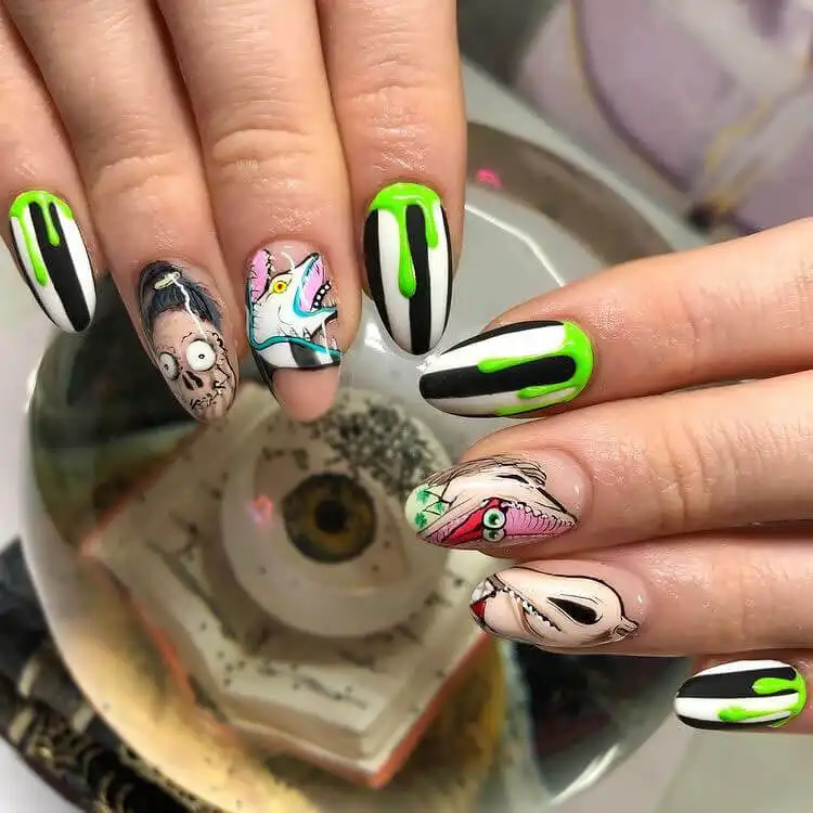 Highly artistic Glow in the Dark Beetlejuice Nails with intricate details and a unique painterly style.