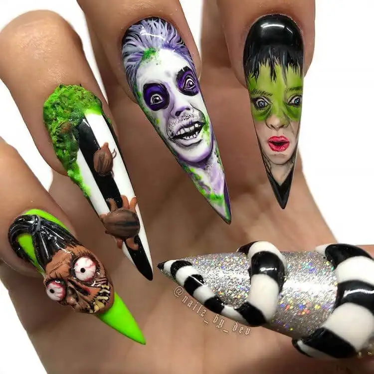Stunning long stiletto Glow in the Dark Beetlejuice Nails featuring elaborate, sprawling thematic artwork.