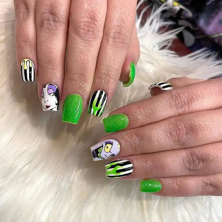 Detailed square Glow in the Dark Beetlejuice Nails showcasing character art of both Beetlejuice and Lydia.