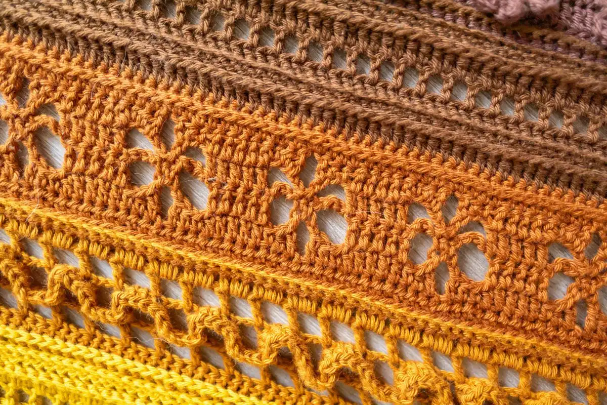 Close-up photo illustrating the 'Waves' section of the Golden Harvest Shawl, showing the raised texture and wave-like effect.