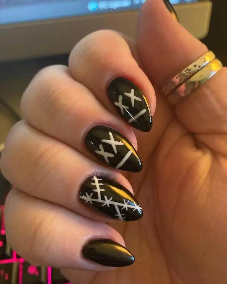 Goth and Emo Nail Designs with Nail Chart 16 Glossy black stiletto nails, showcasing a simple yet powerful and elegant gothic look, with optional small rhinestones